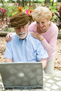 Senior Couple on Computer - Vertical