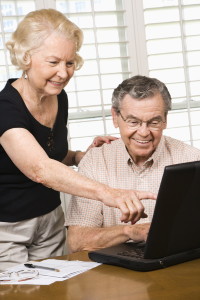 Mature couple with laptop.