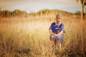 old woman in field