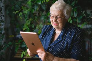 older lady on ipad