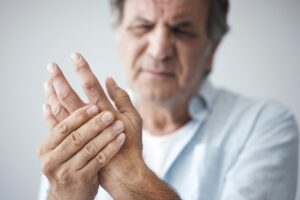 Older gentleman in pain from arthritis.