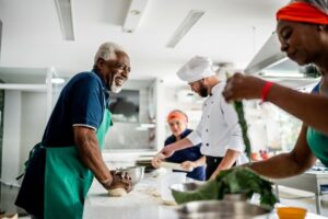 People cooking in a kitchen.