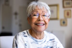 Elderly woman smiling.